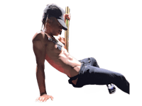 a man laying on the ground with a stick in his hand